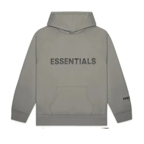 Essentials Hoodie in Grey Sudadera gris con la palabra “ESSENTIALS” en letras negras grandes en el pecho. Incluye bolsillo frontal y capucha, transmitiendo un estilo casual y minimalista.Essentials Hoodie in Grey.
