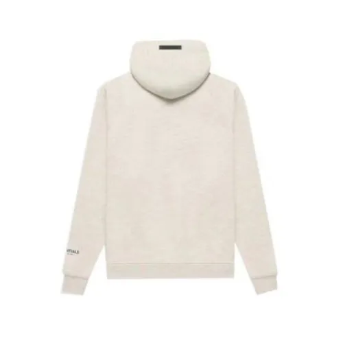 Sudadera con capucha color crema gris humo con "ESSENTIALS" estampado en negro en el pecho, cremallera frontal, bolsillo y diseño cómodo y minimalista back side