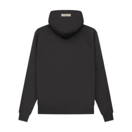 Vista trasera de la sudadera con capucha Essentials Black 1977 con silueta amplia, confección premium y diseño contemporáneo.