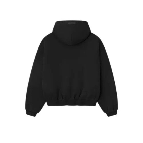 Vista trasera de la sudadera negra con cremallera Essentials, con capucha, corte relajado y diseño minimalista.